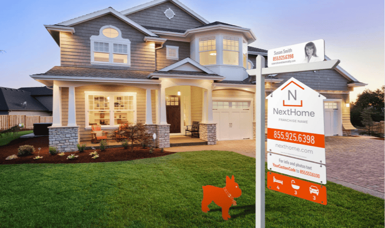 A luxury home with a NextHome-branded listing sign in the front yard